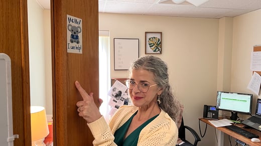ACM employee points to Koala Mental Health First Aid Training token